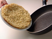 Image of flipping over the noodles.